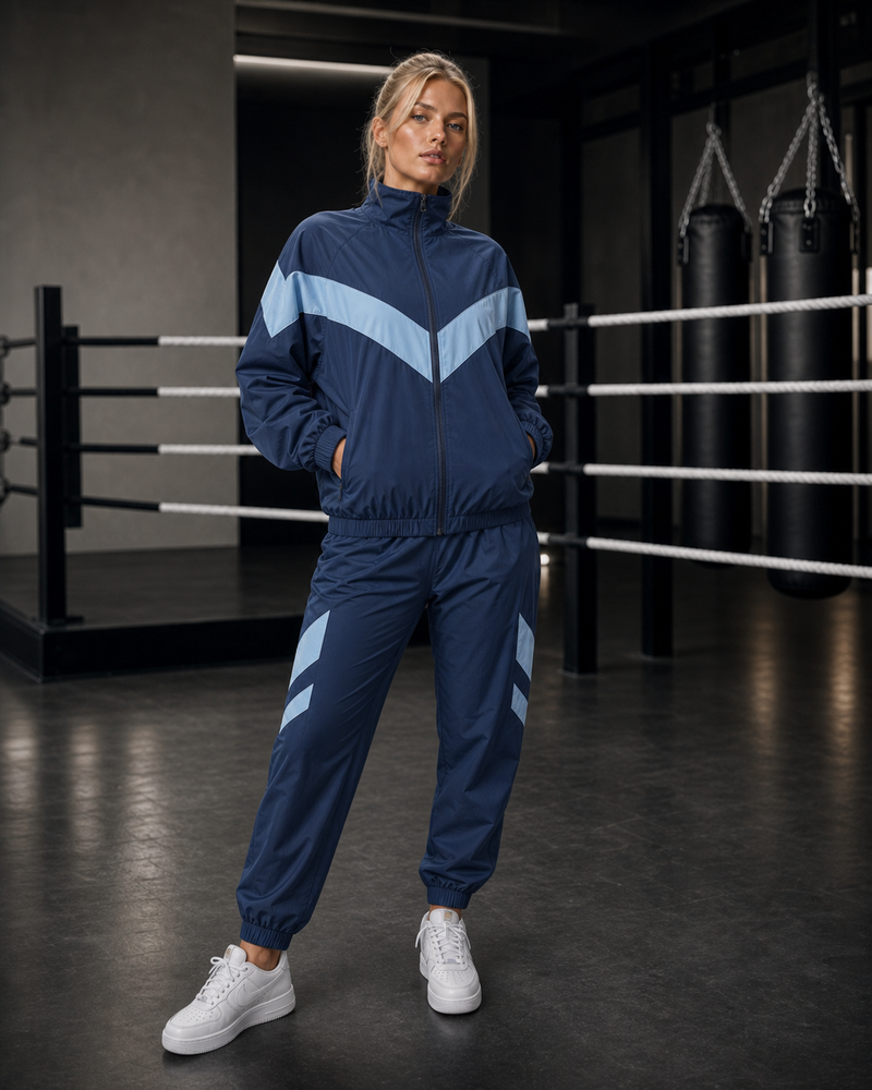 Core Motion Tracksuit — Blue — ATHENIS blonde female model